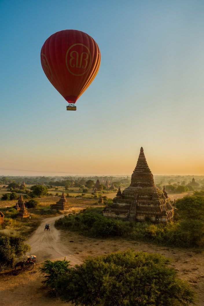 Balloon flies over Old Bagan temple at dawn