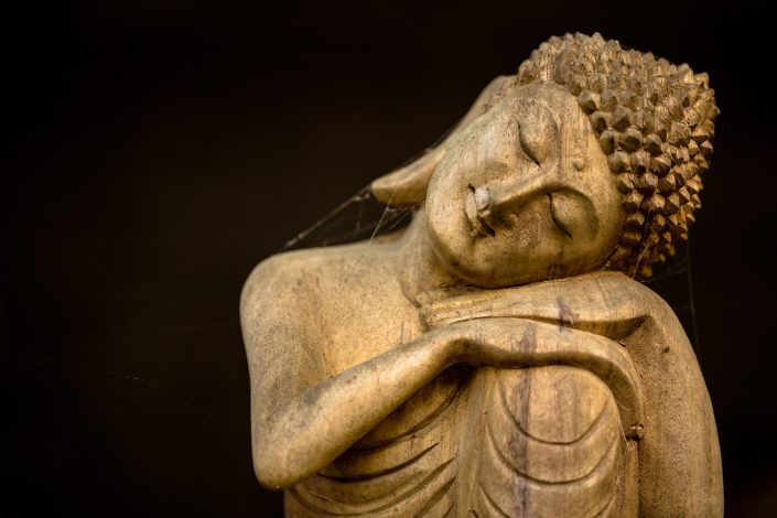 Wooden resting buddha carving