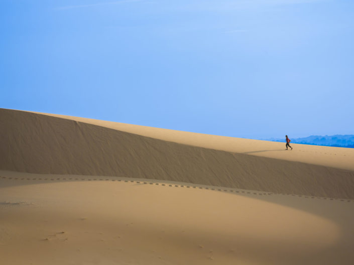 Intrepid Traveler on white sand dunes – Mui Ne, Vietnam