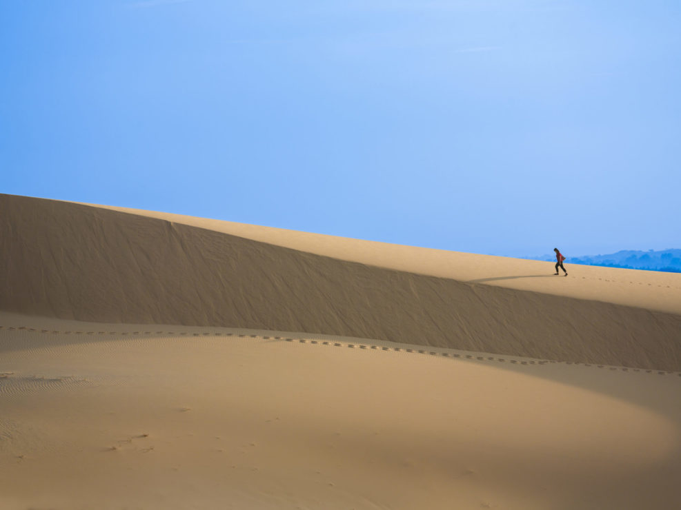 Intrepid Traveler on white sand dunes – Mui Ne, Vietnam