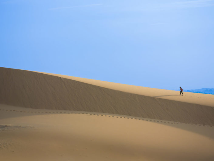 Intrepid Traveler on white sand dunes – Mui Ne, Vietnam