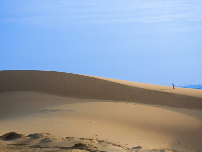 Intrepid Traveler on white sand dunes – Mui Ne, Vietnam