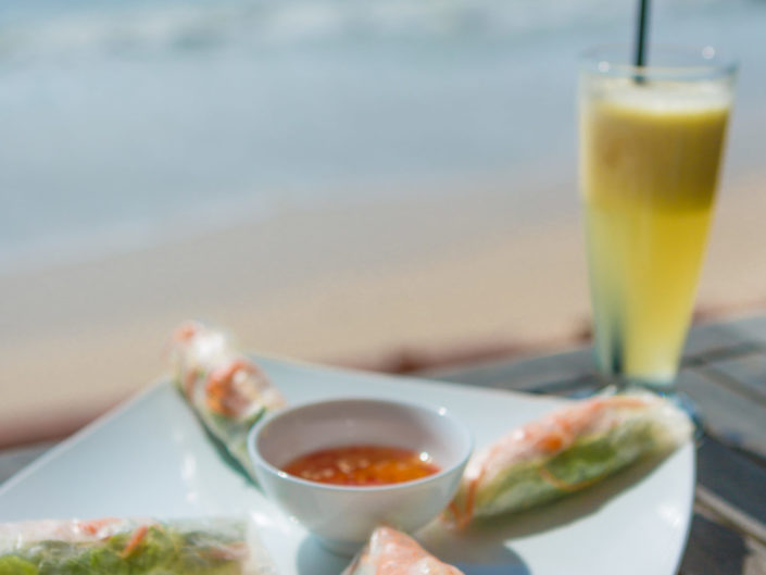 Traditional Vietnamese fresh spring rolls at beach cafe