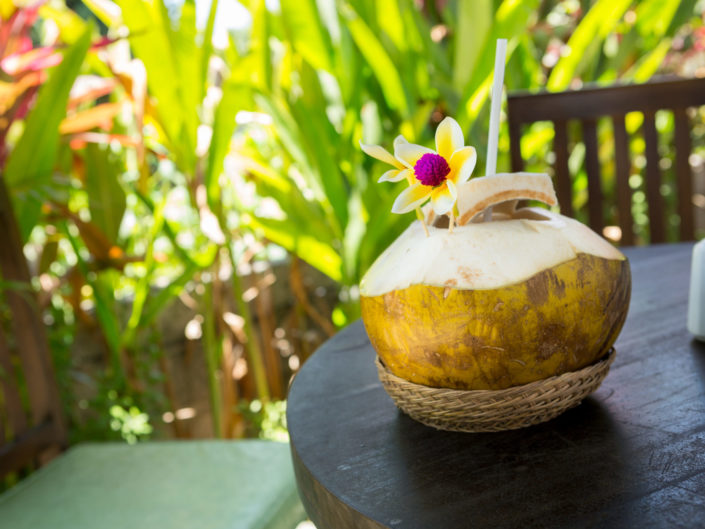 Fresh coconut beverage with flowers