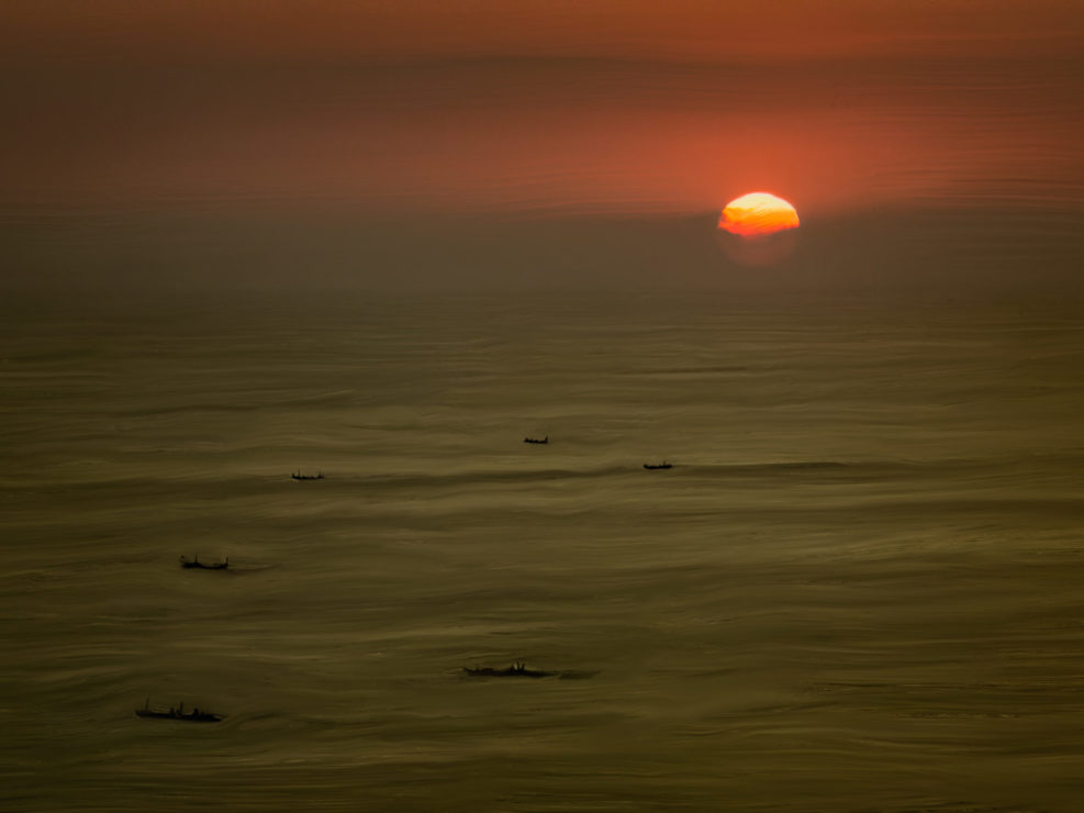 Boat silhouettes at sunset painterly