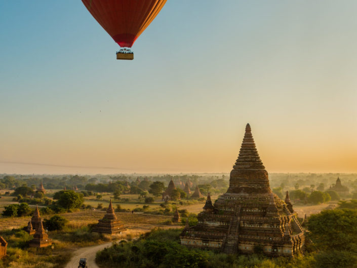 Balloon flies over Old Bagan temple at dawn