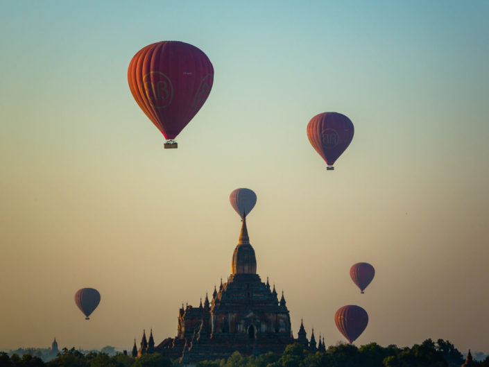 Balloon flies over Sulamani Guphaya temple at dawn – Bagan, Myan