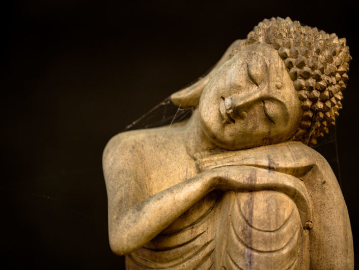 Wooden resting buddha carving