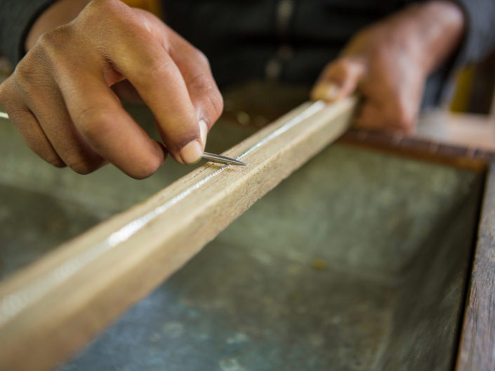 Closeup of silver worker making a chain