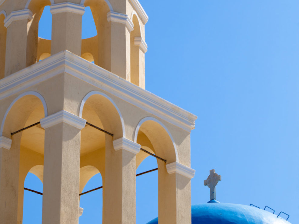 Yellow Belfry and Dome of Church in Santorini, Greece